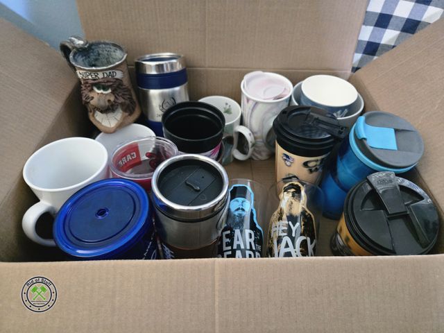 Lot 53-540 - Box full of mugs, glasses and insulated beverage mugs - Includes: 2 glass duck dynasty cups.
