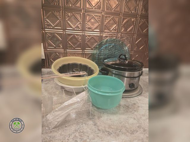 Lot 53-586 - Tupperware Bowls, 6qt crockpot, Serving Platters and more. Bring boxes to load.