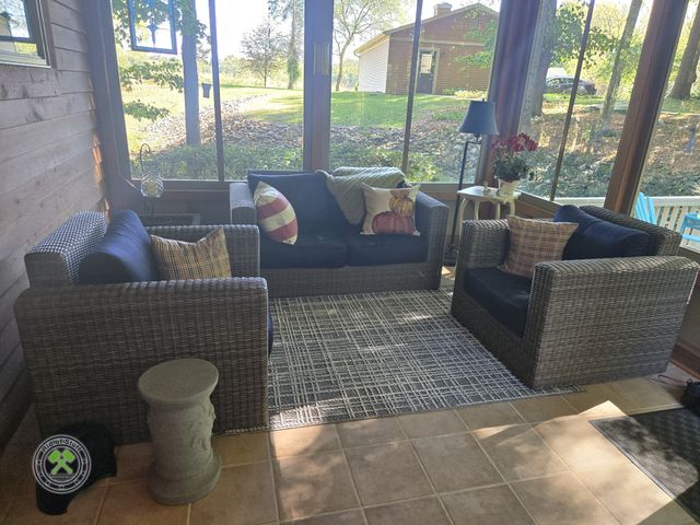 Lot 53-662 - 5 Piece Outdoor Furniture Set - Sofa, 2 chairs, table and outdoor rug. with serving platter and deco...