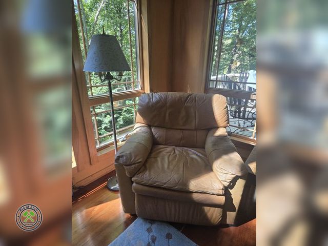 Lot 53-525 - Faux Leather Oversized Chair with Floor lamp - Chair is clean but does have some wear