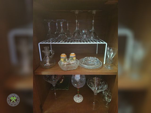 Lot 53-550 - Cabinet Contents - Includes: Glassware, Wine Glasses, Wire Shelf, and more - Bring Box to load
