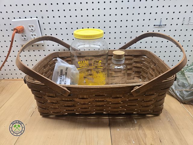 Lot 53-640 - Longaberger Basket with handles, Glass Tea Dispenser and small Glass Jar