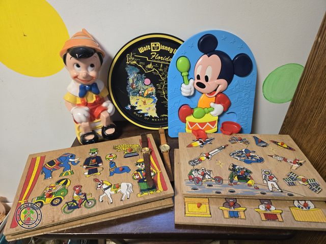 Lot 53-737 - Lot of Vintage Wooden Kids Puzzles, Vintage Plastic Mickey Mouse Puzzle, Disney Pinocchio Bank, Wris...