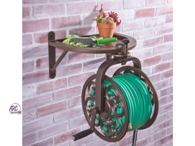 Lot 56-611061 - New Opened Box - 125 ft. Bronze Steel Rotating Wall Mounted Garden Hose Reel