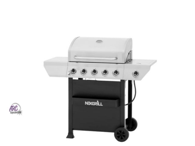 Lot 56-768638 - New in box. Nexgrill 5-Burner Propane Gas Grill in Stainless Steel with Side Burner and Condiment Ra...