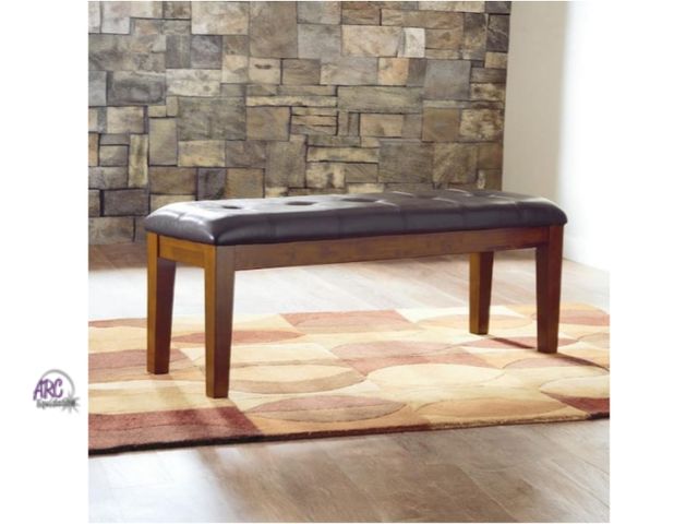 Lot 56-771851 - New in box. Signature design by Ashley Ralene Casual Medium Brown Faux Leather 50 in. 4-Legs Dining ...