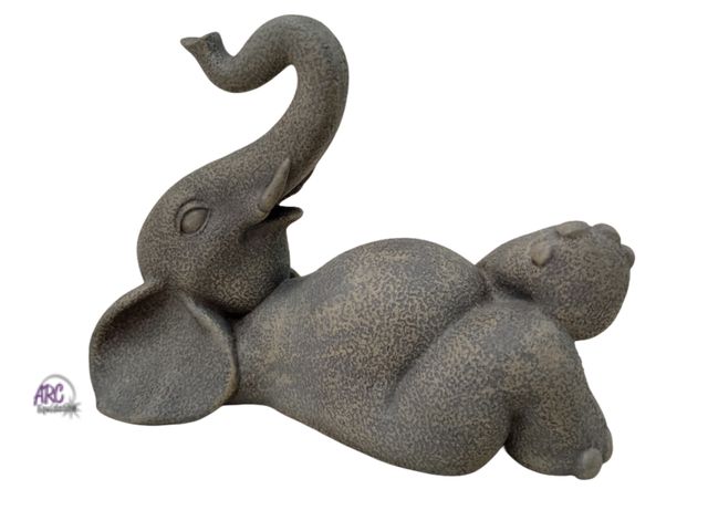 Lot 56-783612 - New 7" lounging elephant. Cement color