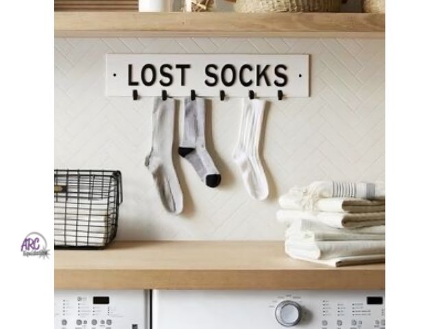 Lot 56-203030 - NEW Hearth &amp; Hand With Magnolia "LOST SOCKS" METAL/ ENAMELWARE SIGN 23.6"X 5"