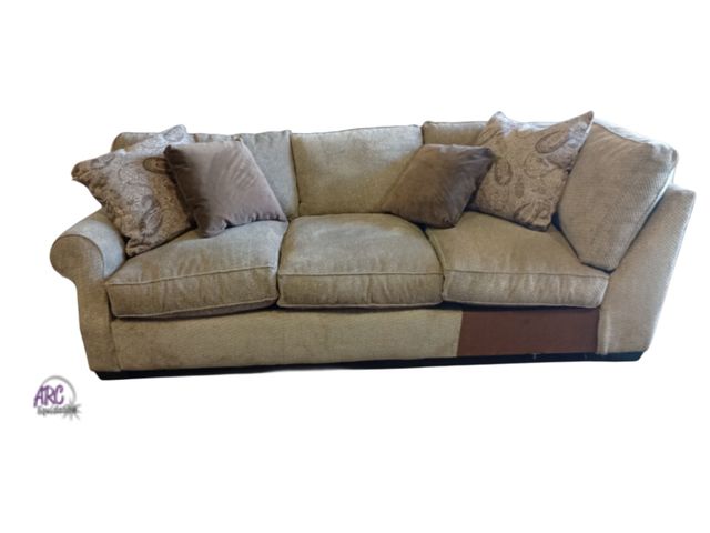 Lot 56-737817 - New couch(right arm of sectional only) 101" x 44" . Comes with decorative pillows. Small Knick in ba...