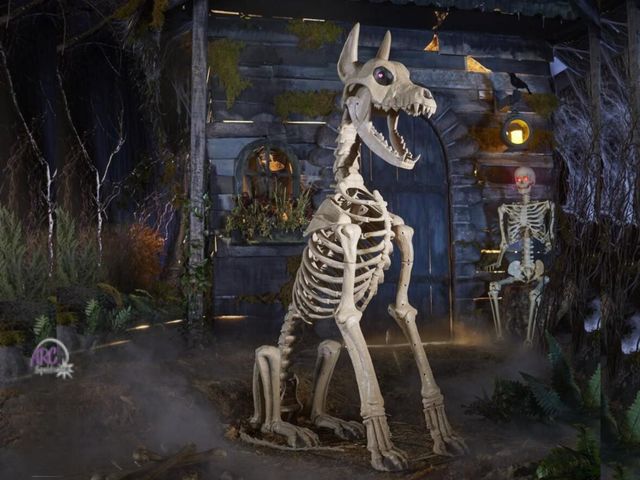 Lot 56-410934 - New tested and works - Home Accents Holiday 5 ft. Grave &amp; Bones Skelly's Sitting Dog with LifeEy...