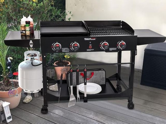 Lot 56-757660 - New in box. Royal gourmet 4-Burner Portable Flat Top Propane Gas Grill and Griddle Combo with Foldin...