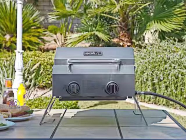 Lot 56-601860 - New Opened Box - NexGrill 2-Burner Portable Propane Gas Table Top Grill in Stainless Steel
