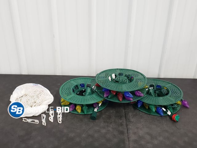 Lot 58-80956 - Bag of Christmas Lights with clips with a storage tote for the lights - used but works