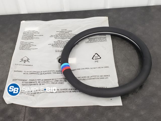 Lot 58-39384 - Custom Steering Wheel Cover for a Jeep - Appears Unused