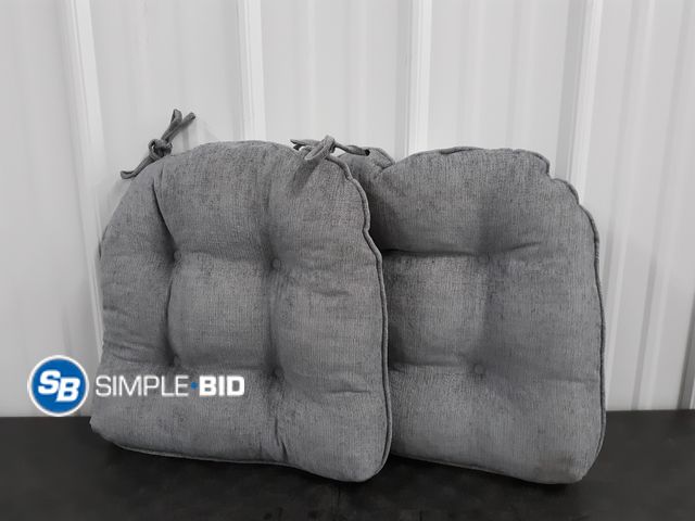 Lot 58-36664 - Lot of (2) New Grey Homegood limited seat cushions with tie straps - approx 18" x 18"