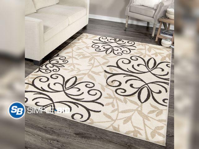 Lot 58-74865 - Better Homes &amp; Gardens Iron Fleur 6'7" X 9'8" Off White Floral Rug - used but in good condition