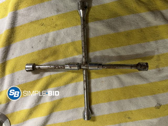 Lot 58-38683 - Folding 4 Way Tire Iron