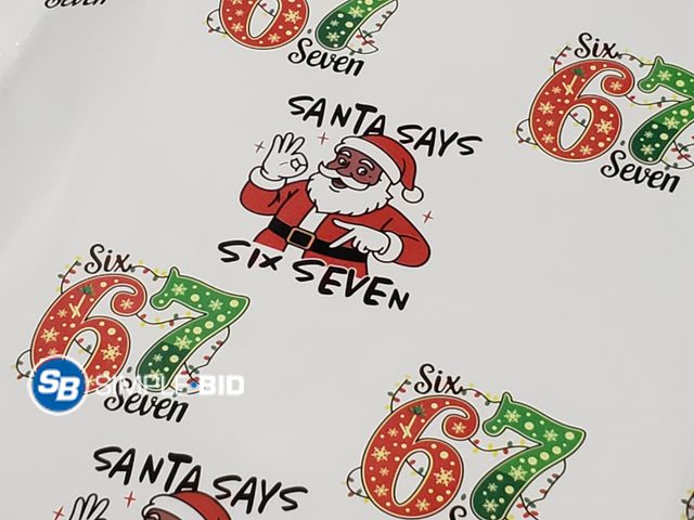 Lot 58-71662 - CHRISTMAS IN JULY! Lot of (4) New Sheets of Wrapping paper -- 67 -- Santa Says 67 with Ribbon with e...