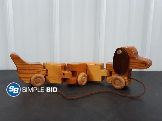 Lot 58-37455 - Wooden Wiggly Rolling Dog