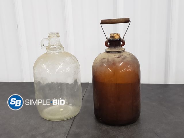 Lot 58-83417 - Lot of (2) Vintage Glass bottles (1) one Gallon (1) Amber One Gallon