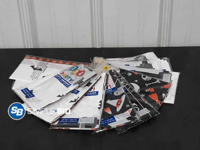 Lot 58-27710 - Lot of (11) New Plastic table covers - 54" x 84" - variety of styles - reusable - washable - waterpr...
