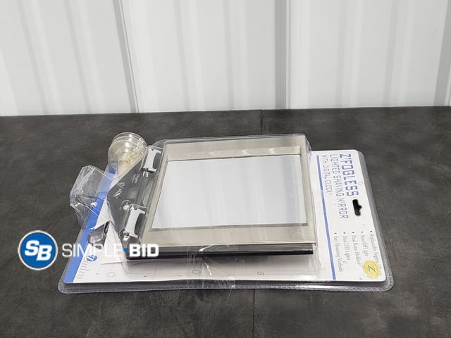 Lot 58-30743 - Z'Fogless Lighted Shaving Mirror with Digital Clock - appears unused