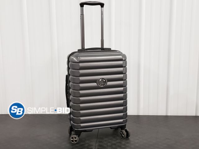 Lot 58-71111 - Delsey Hard Cover Spinner 20" Carry on - in good condition