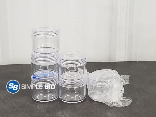 Lot 58-75800 - Lot of (48) Small Round Clear Travel Containers in Plastic Tote