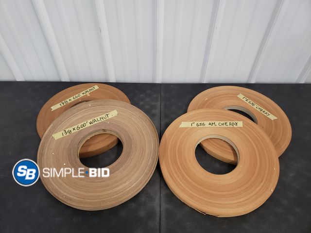 Lot 58-59401 - Lot of (4) Rolls of Wood - 2 Rolls of 1" 656 AM Cherry, 1 Roll of 1 3/8" 660 Walnut, and 1 Roll of 1...