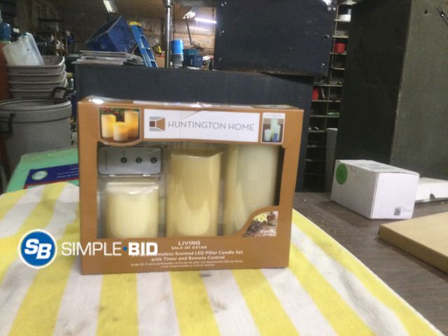 Lot 58-59611 - Huntington Home 3 Piece Flameless Vanilla  Scented Pillar Candle Set