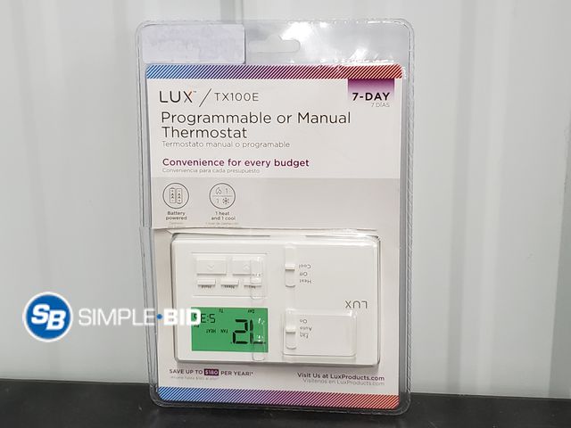 Lot 58-70553 - Lux Programmable or Manual Thermostat - Package is Open but Appears Unused