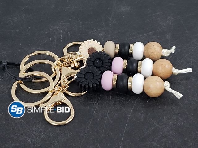 Lot 58-60382 - Lot of (3) New super cute keychain silicone flower keychains