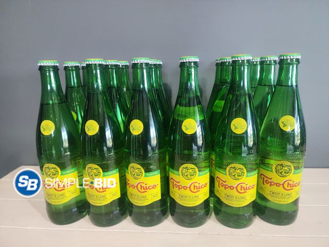 Lot 58-35612 - TOPO CHICO! Lot of (17) Topo Chico Twist of Lime 16.9 fl oz each - unopened - out of box - Glass bot...