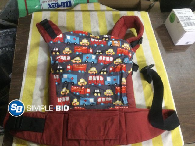 Lot 58-59599 - Tula Red and Grey Baby Carrier with Cars and Trucks