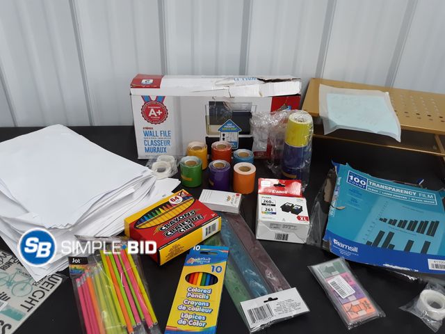 Lot 58-67944 - Lot of Home, School, and office Supplies including Paper, Computer stand, Markers and much more - un...