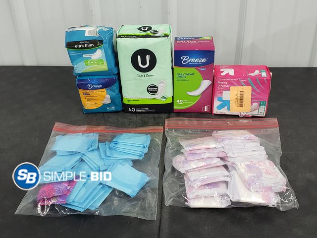 Lot 58-60446 - Lot of Women's pads, Daily liners and more - unopened - some out of boxes