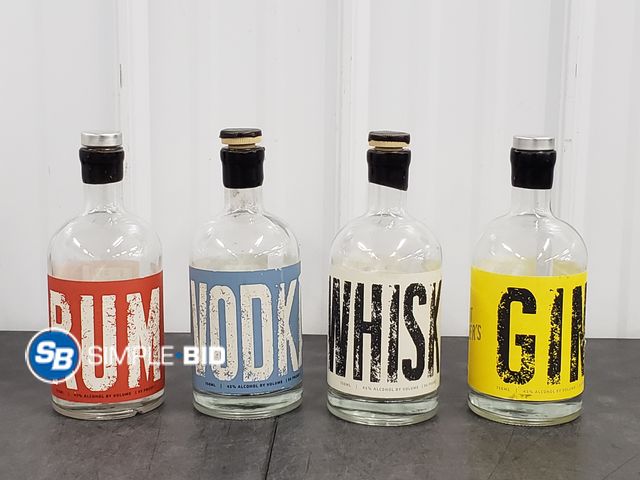 Lot 58-75749 - Lot of (4) Flat Lander's Empty Glass Bottles - Rum, Vodka, Gin, Whisky