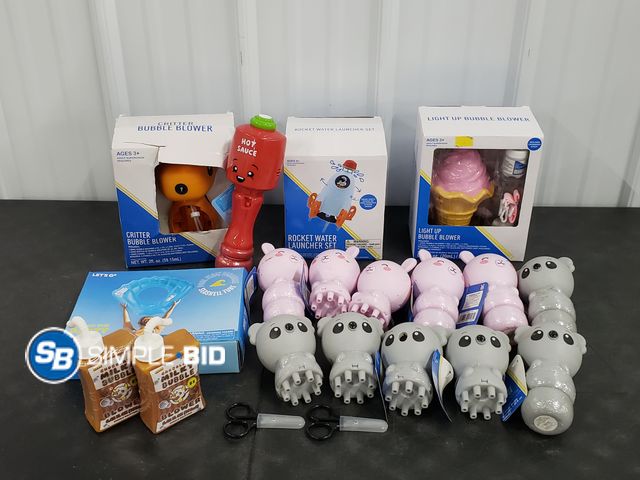 Lot 58-39846 - Lot of Kid's TOYS including Bubble blowers, pool float, Rocket launcher and more - appears unused