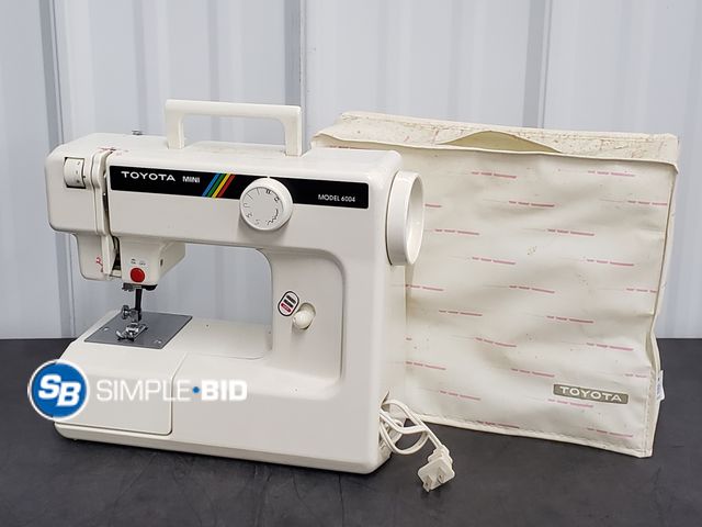 Lot 58-75881 - Toyota Mini Sewing Machine Model 6004 with Soft Cover