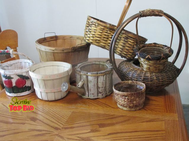 Lot 59-10085 - Lot of 8 baskets, most are vintage looking, would look very good as porch of yard decor.  One is han...