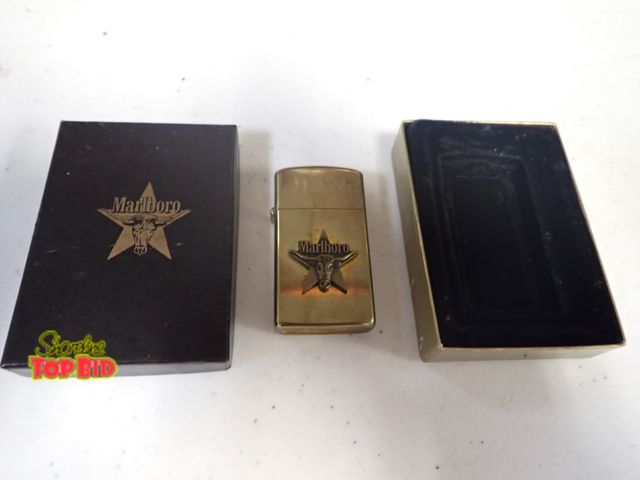 Lot 59-41495 - 1991 Zippo lighter brass  Marlboro long horn steer on star VIII monogrammed HJW unused