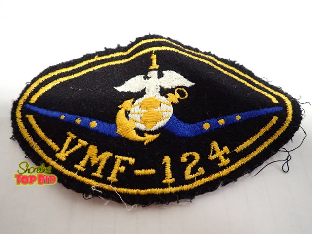 Lot 59-14665 - Original/Authentic WWII-era VMF-124 Marine Corp Eagle, Globe &amp; Anchor (EGA) Set against a blue s...
