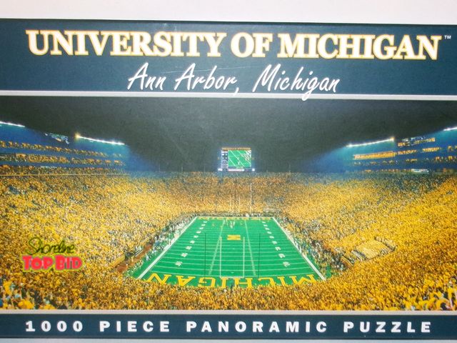 Lot 59-74486 - Michigan Wolverines Stadium 1000-piece Puzzle New Open Box - Complete - pieces still in sealed bag.