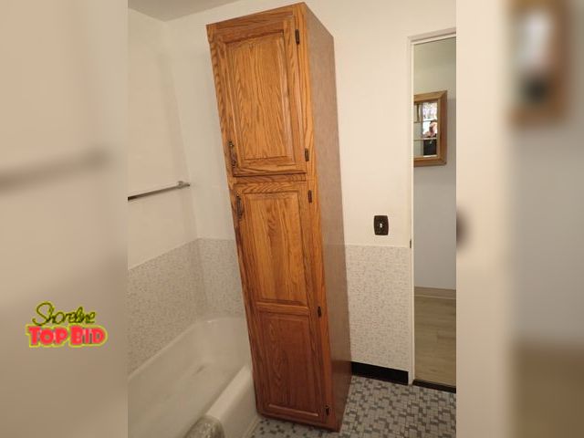 Lot 59-43441 - Double Door Oak Storage Cabinet 84" x 18" x 22"