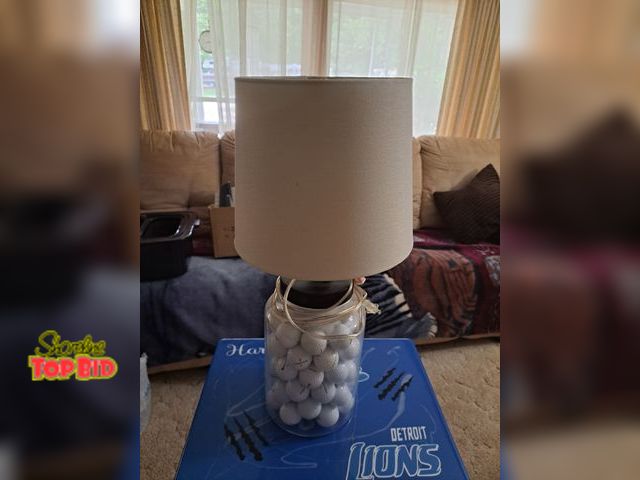 Lot 59-76020 - Golf balls lamp..23 1/2 inches tall..working