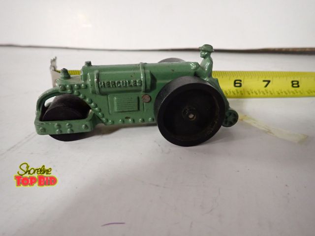 Lot 59-43350 - Antique Cast Iron Hercules Steam Roller with Driver, Wooden Wheels, Great Condition 5" long