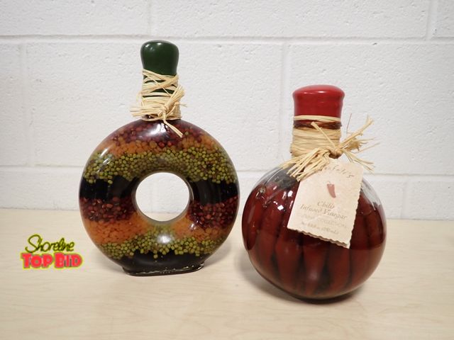 Lot 59-33149 - 2 Decorative Glass Bottles - Vintage Pepper and Herb Infused or Spices