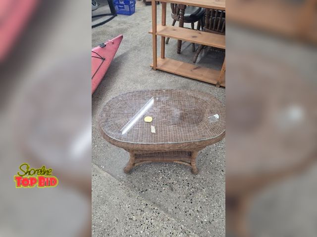 Lot 59-95004 - OFFSITE  Coffee table with glass top  35 in wide 20 in depth  19 in tall