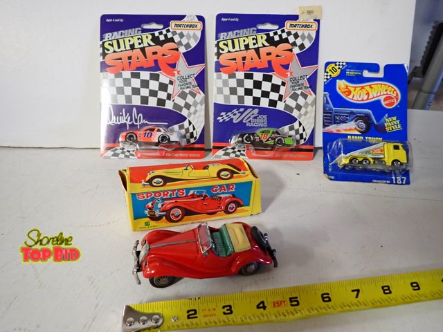 Lot 59-43717 - 4 Collectible Toy Cars with Original Packaging
