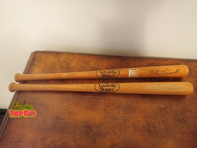 Lot 59-43469 - 2 Mini Louisville Slugger Bats